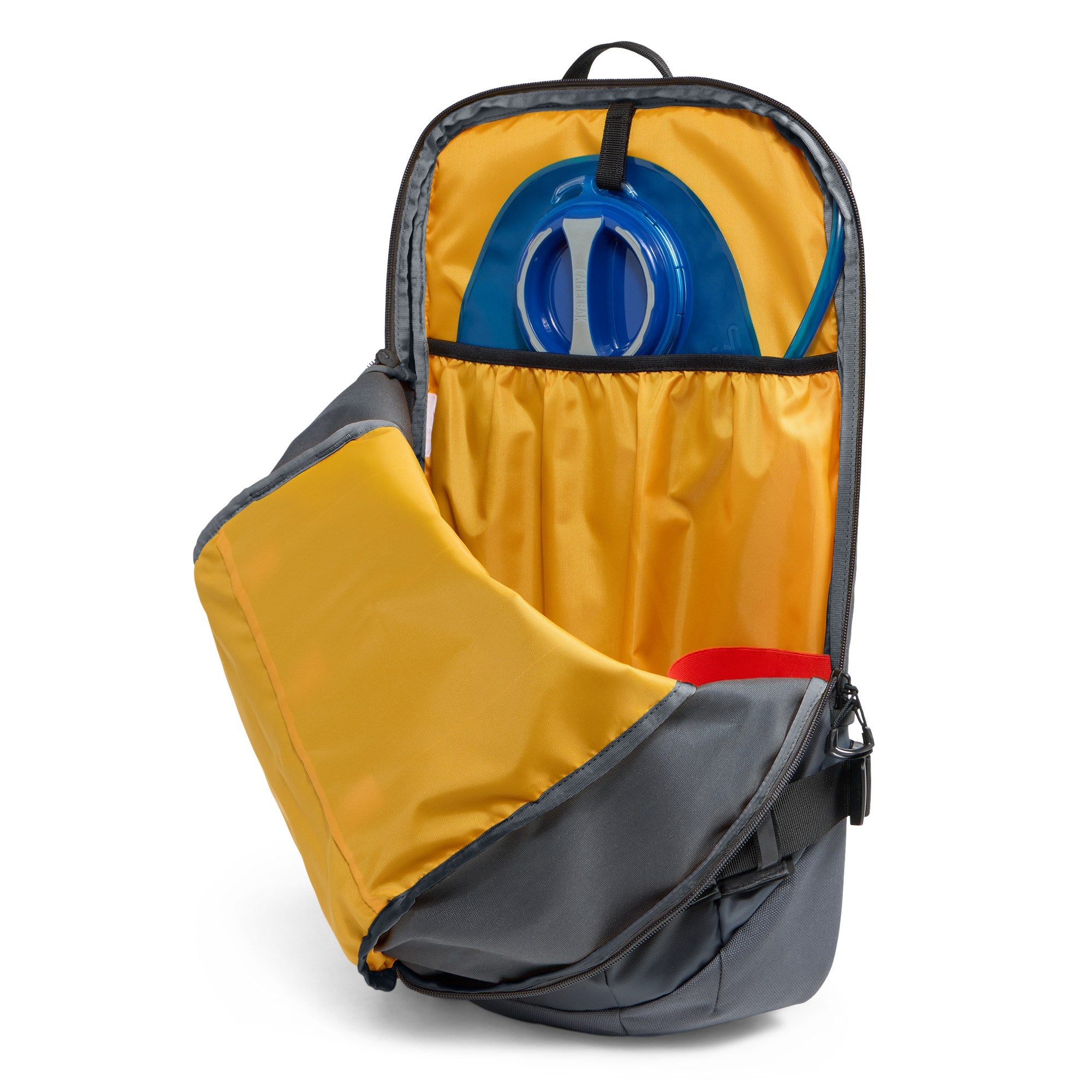 Open hydration compartment on The North Face Slackpack 30 snow backpack showing the internal reservoir sleeve and bright yellow lining.