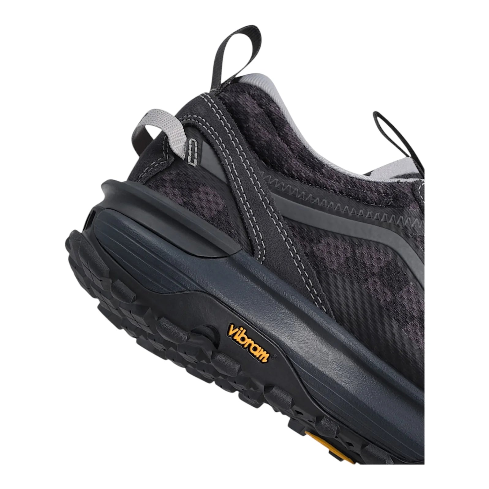 Close-up of the reinforced heel, rear pull tab, cushioned midsole and Vibram outsole on the Vans Crosspath XC shoe.