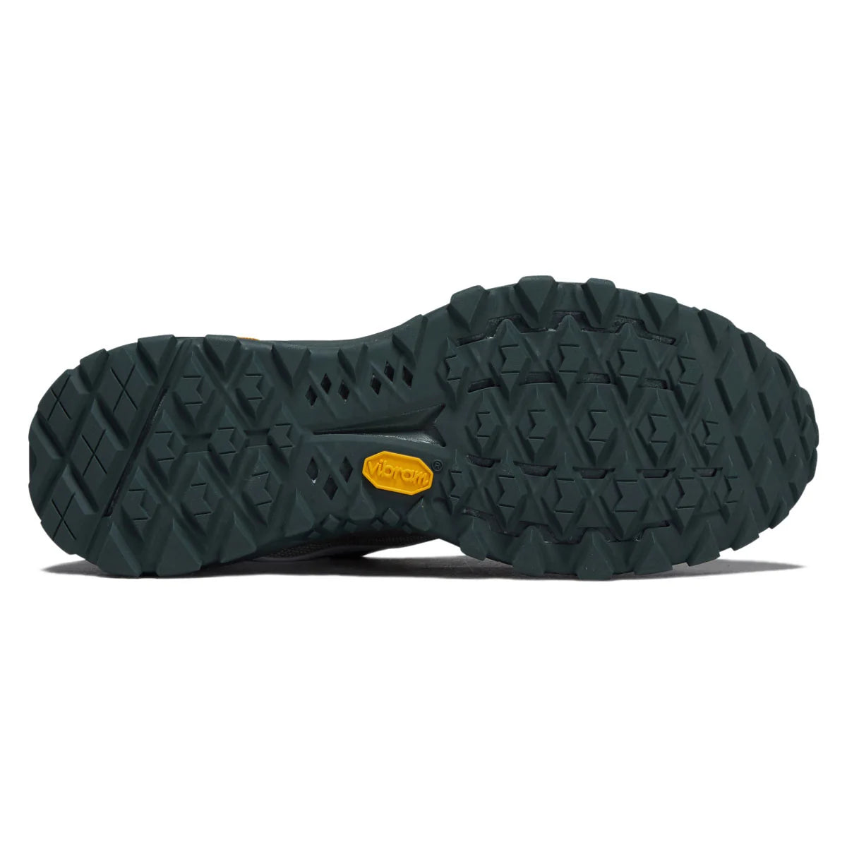 Bottom view of the dark Vibram XS TREK EVO outsole and aggressive multi-directional tread on the Vans Crosspath XC.