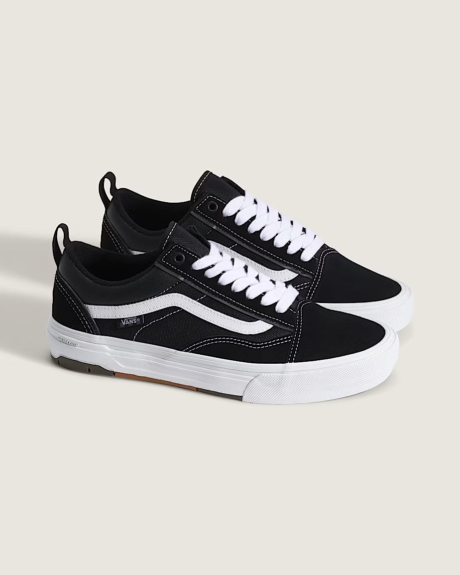 Pair of Vans Skate Old Skool Wafflecup shoes in black and white shown from a front three-quarter angle with white Sidestripes and reinforced skate construction.