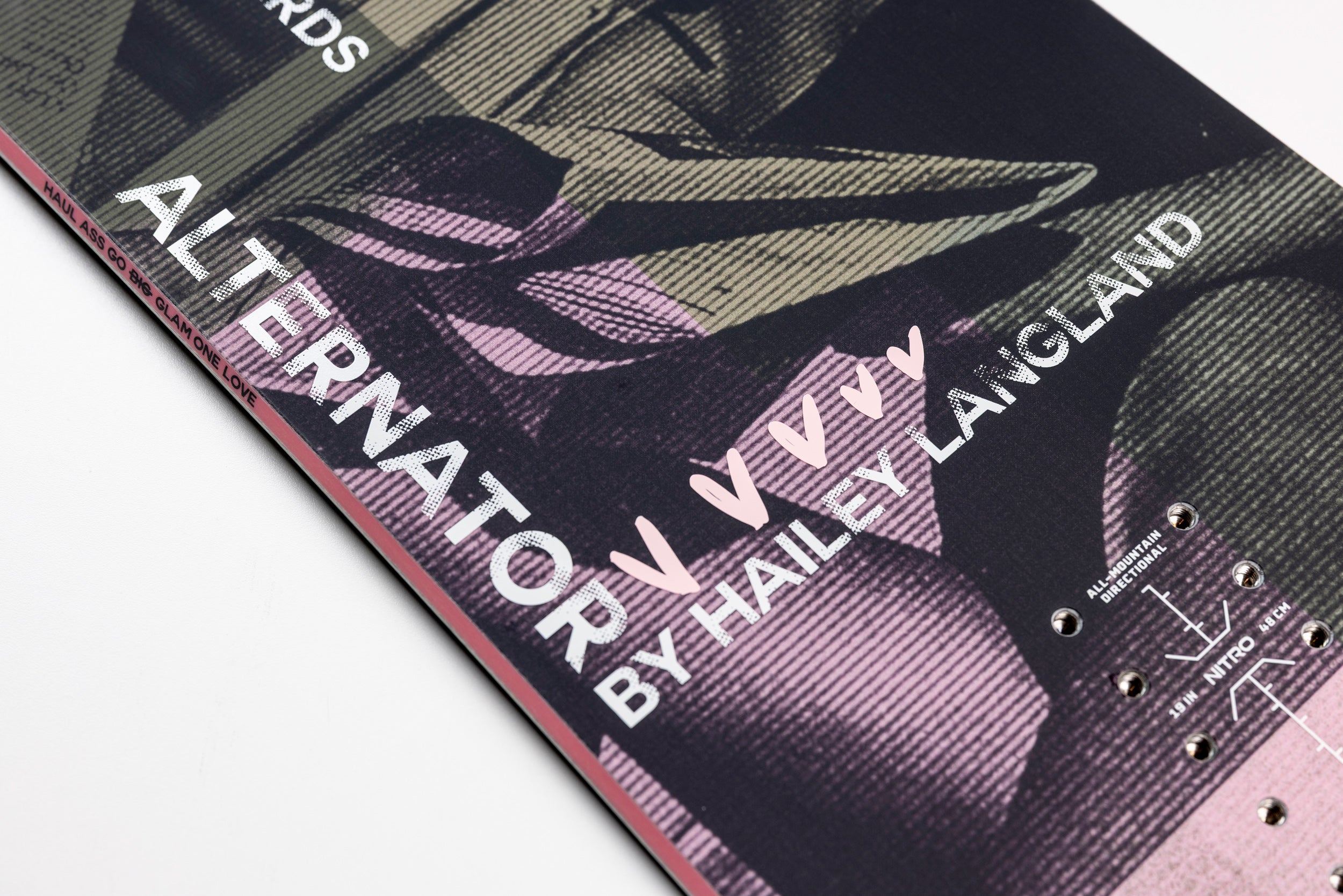 Nitro Alternator X Hailey women's snowboard with detailed top sheet design, showing the snowboard's graphics and vibrant colors.