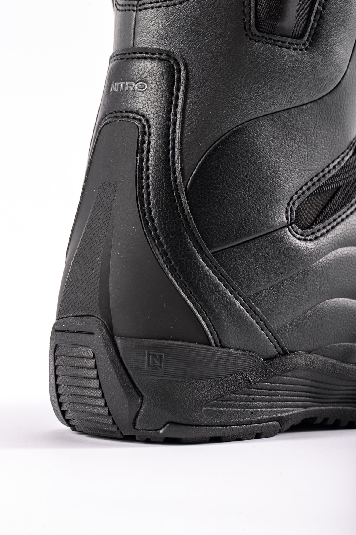 Nitro Crown TLS Women's Snowboard Boots 2027 with heel detail, black and white design, and secure lacing system for winter snowboarding.
