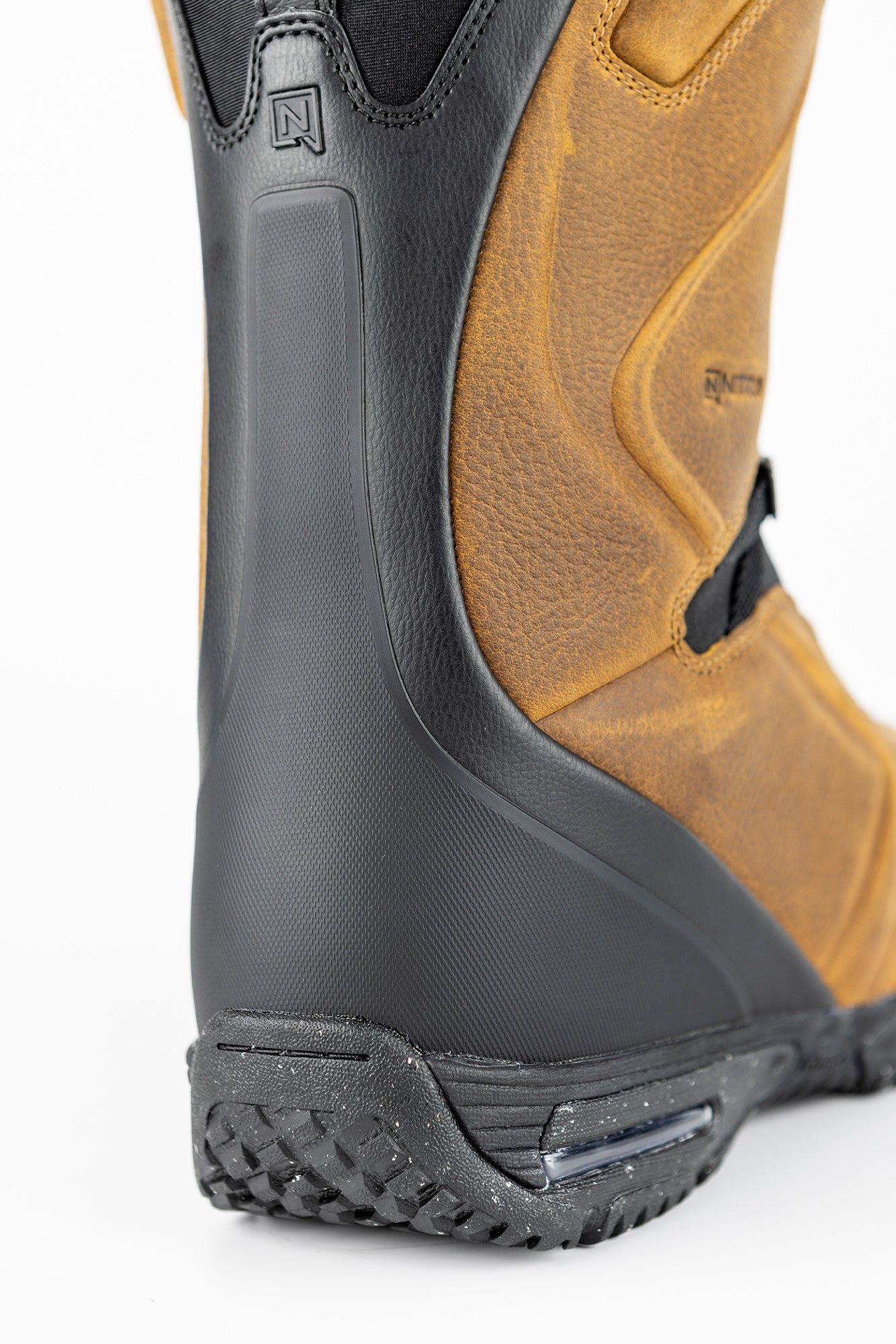 Back view of Nitro El Mejor TLS+ snowboard boots 2027, showing black and gray design with supportive ankle straps.