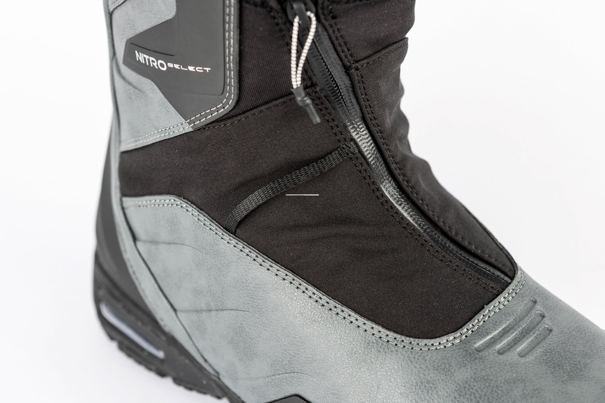 Nitro Select TLS+ snowboard boots 2027 in black with white accents, featuring secure lacing and padded ankle support.