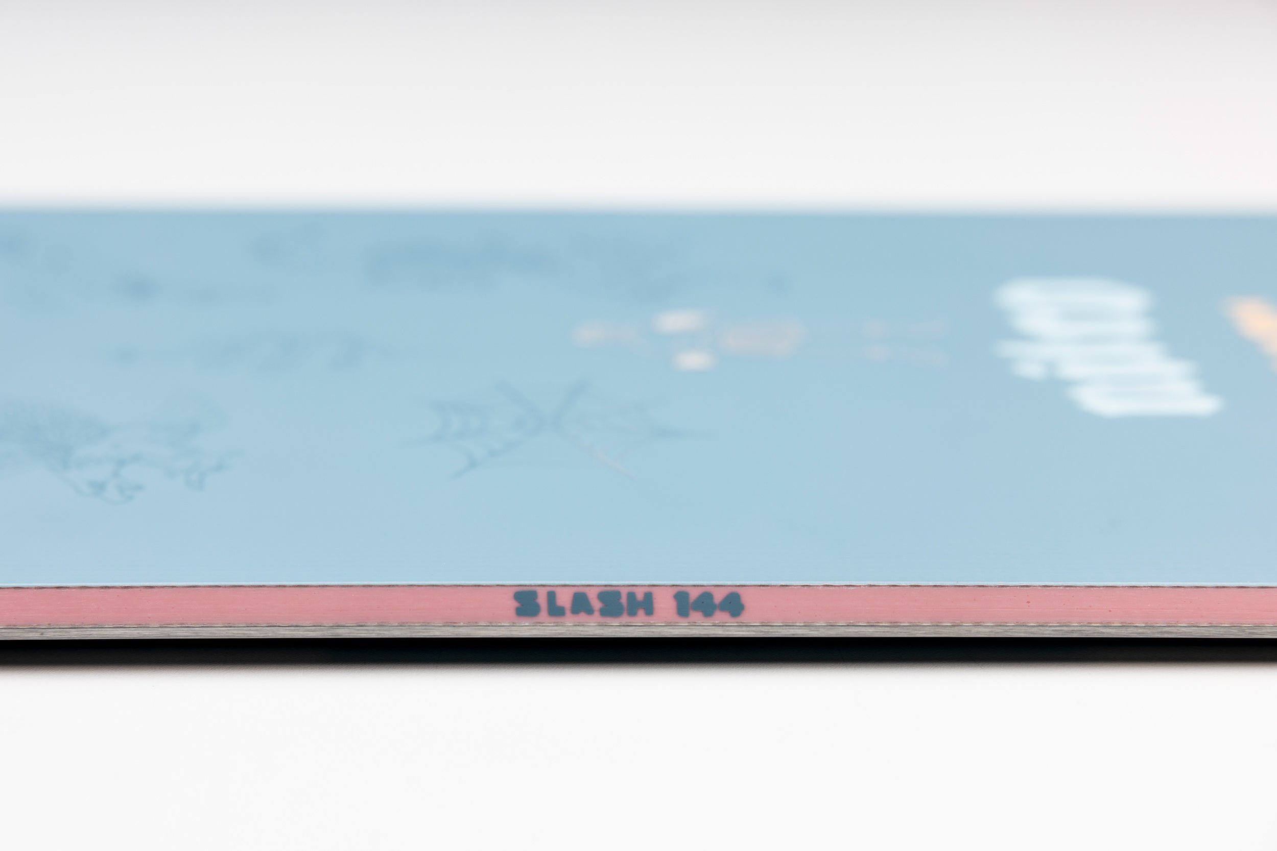 Nitro Slash Quiver Series snowboard 2027 sidewall view, showcasing the Nitro brand and sleek snowboarding design.