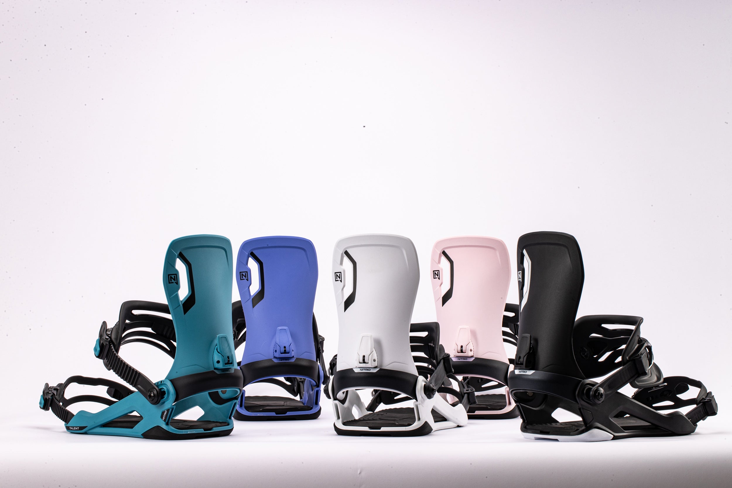 Nitro Talent snowboard bindings 2027 shown on a snowboard, featuring black and red design with adjustable straps and high-back support.