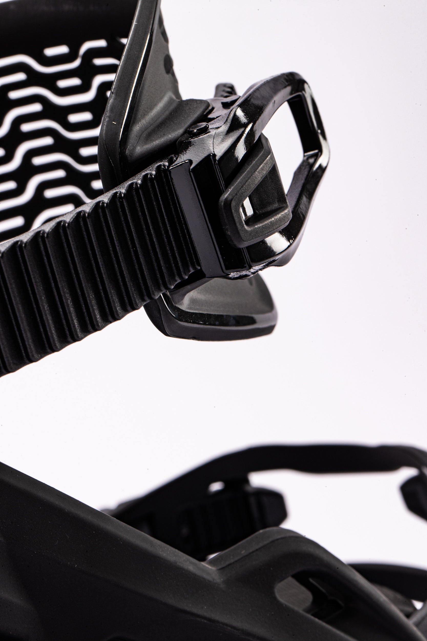 Black Nitro Team snowboard bindings with ankle ratchet straps, designed for secure fit and performance on snow.