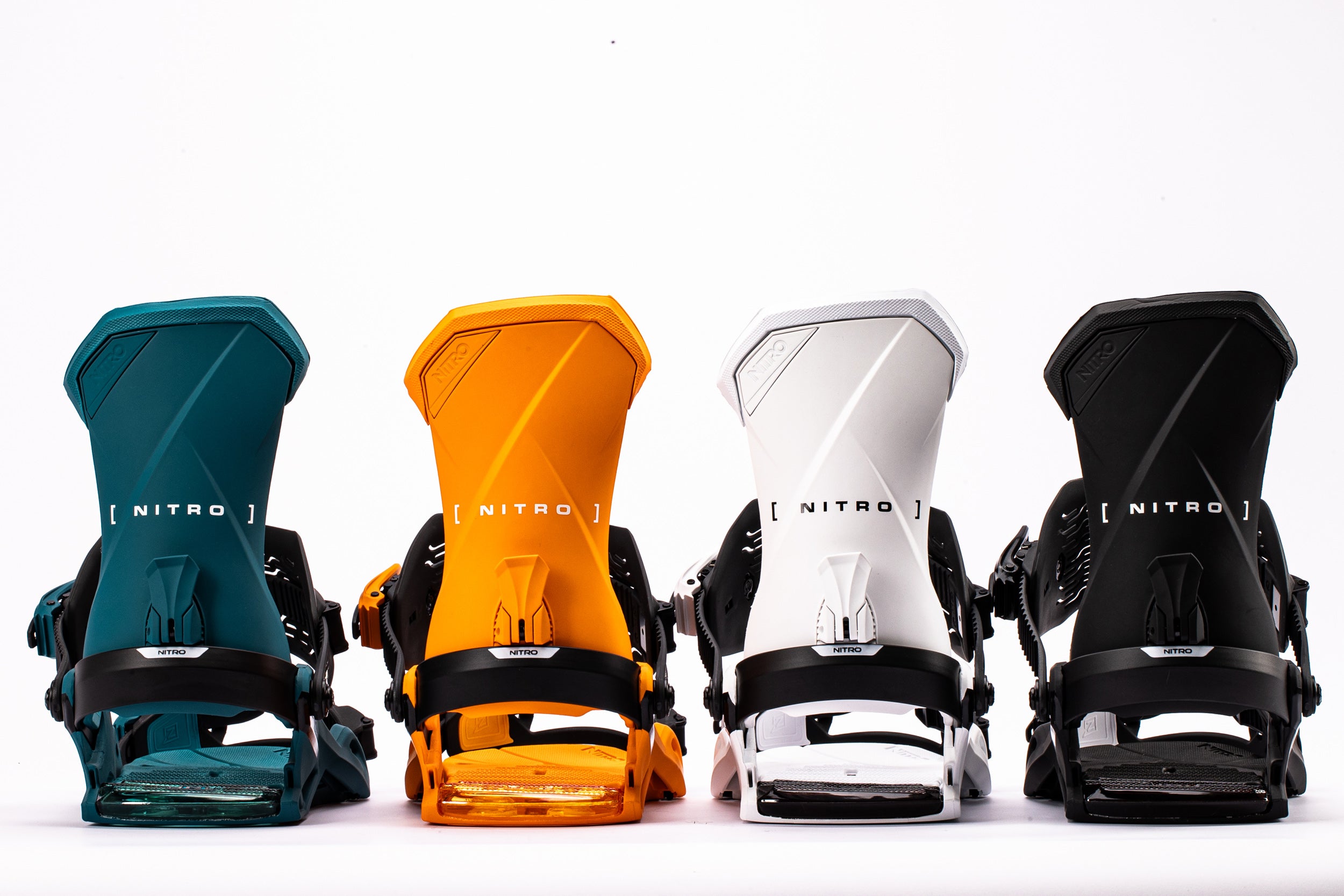 Nitro Team snowboard bindings in black and red mounted on a snowboard, designed for performance and durability.