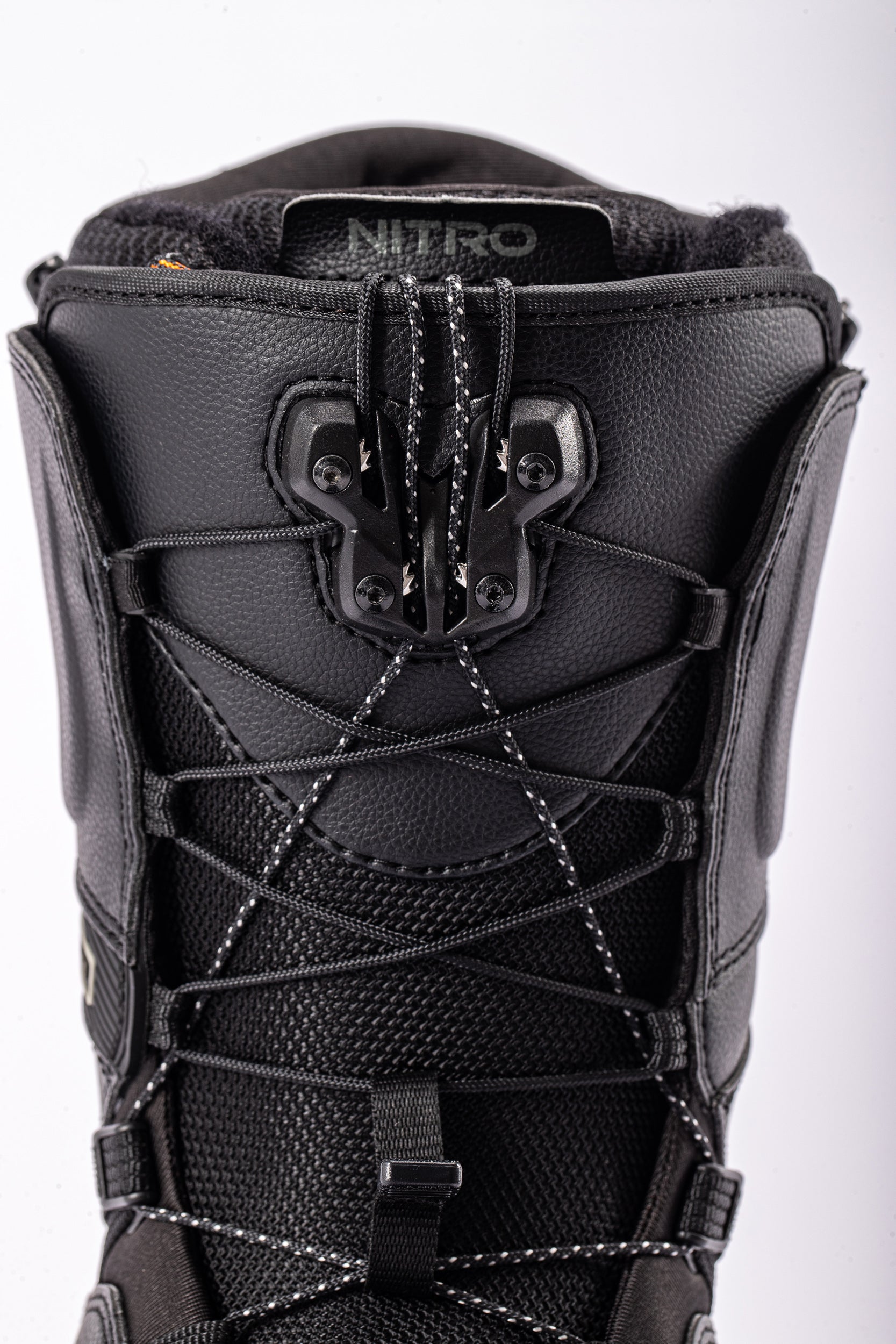 Black Nitro Team TLS snowboard boots from the front, featuring laces, designed for snowboarding performance and comfort.