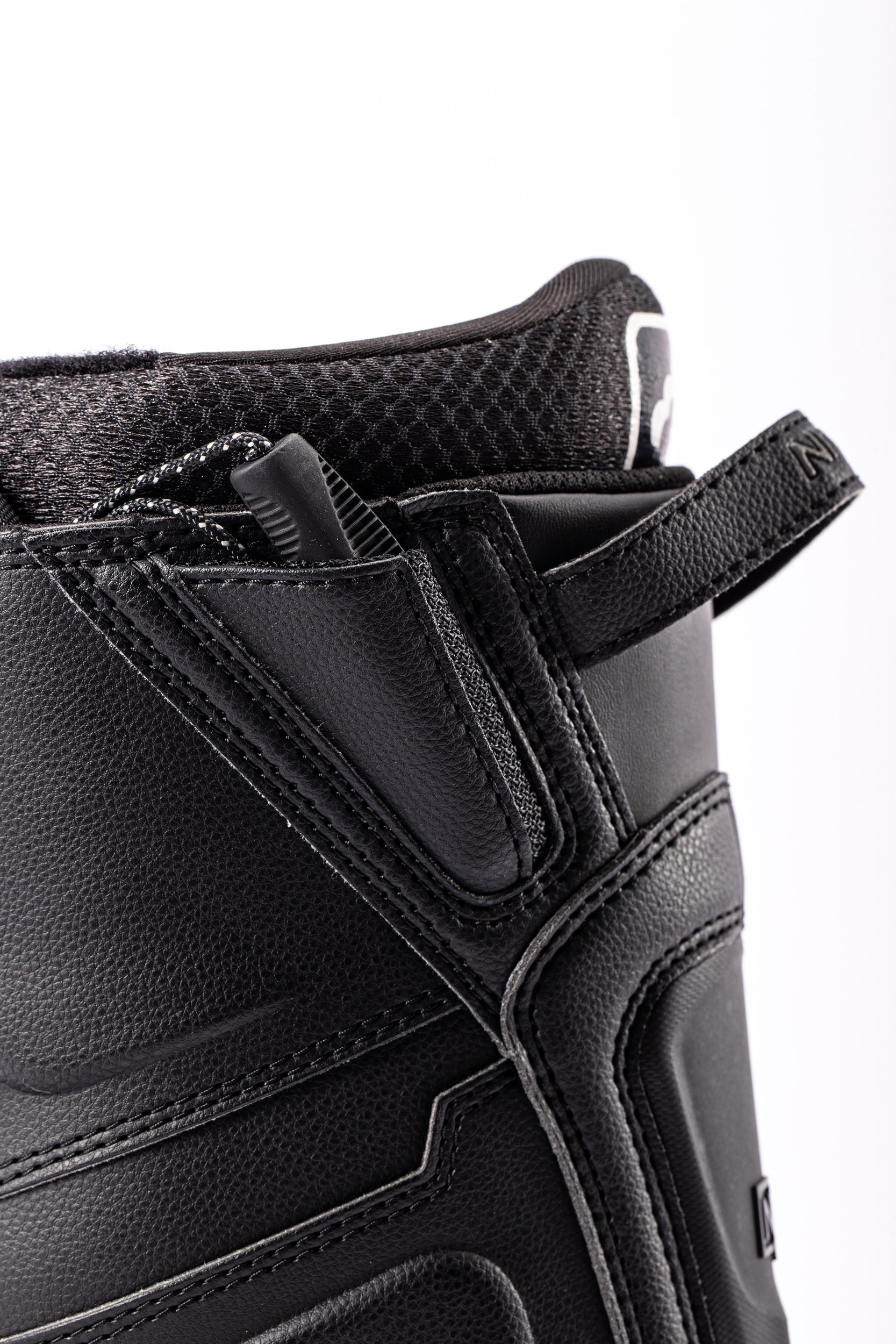 Black Nitro Team TLS snowboard boot with heel loop, designed for snowboarding, featuring a secure fit and durable construction.