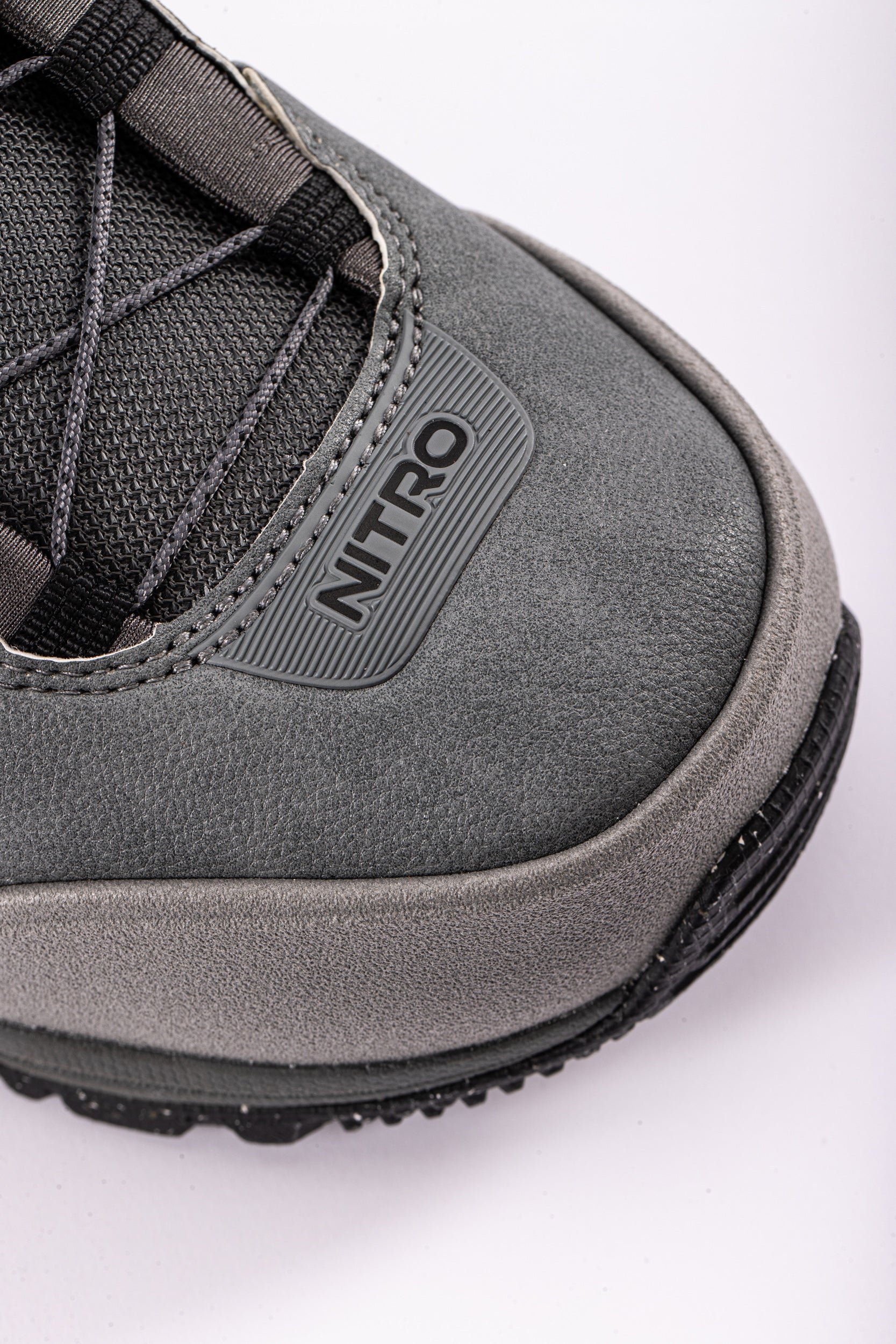 Nitro Team TLS snowboard boots in grey with secure toe lacing system, designed for winter snowboarding adventures.