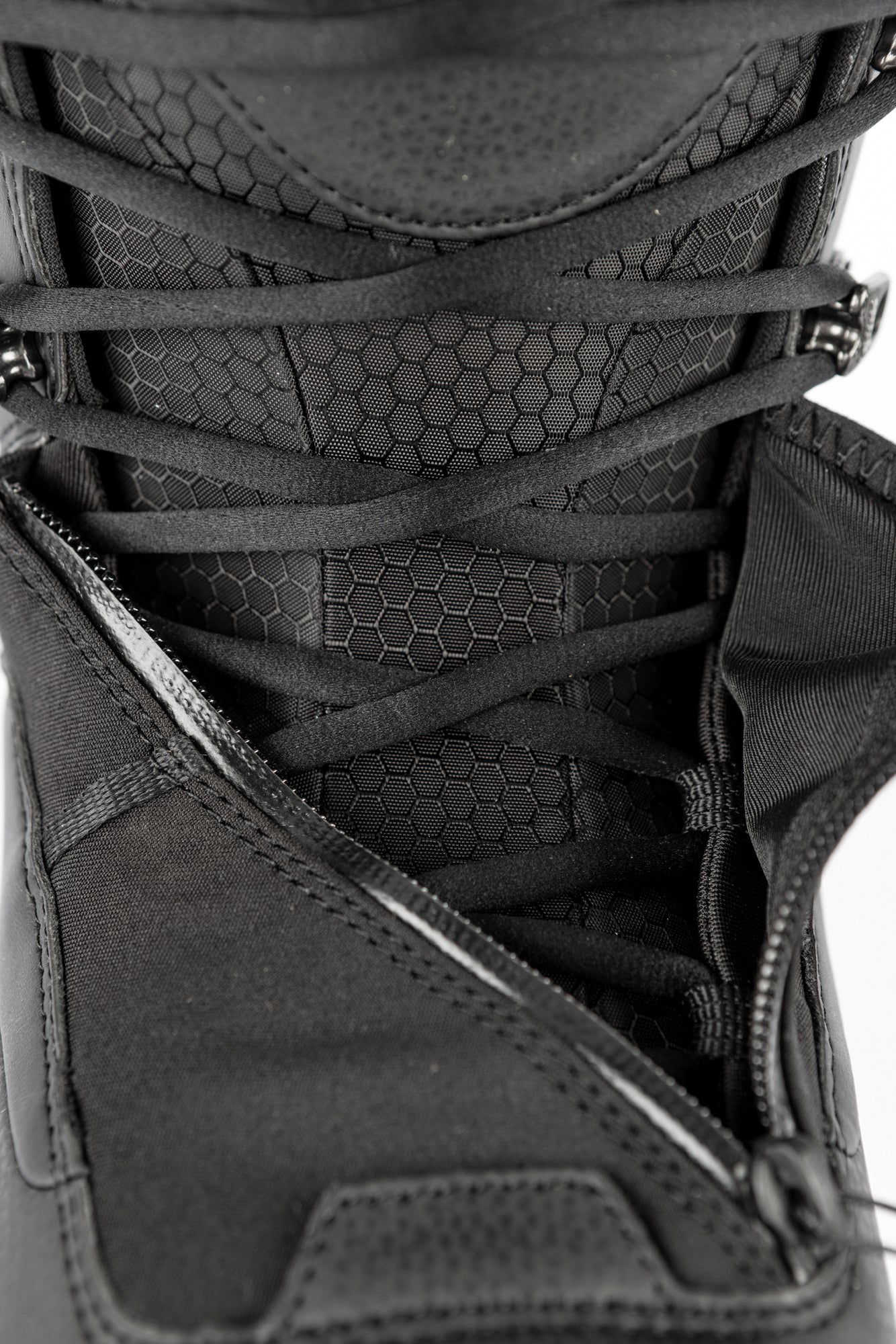 Black Nitro Venture Pro Lace Snowboard Boots unzipped, showing interior lining and lacing system, designed for snowboarding performance.