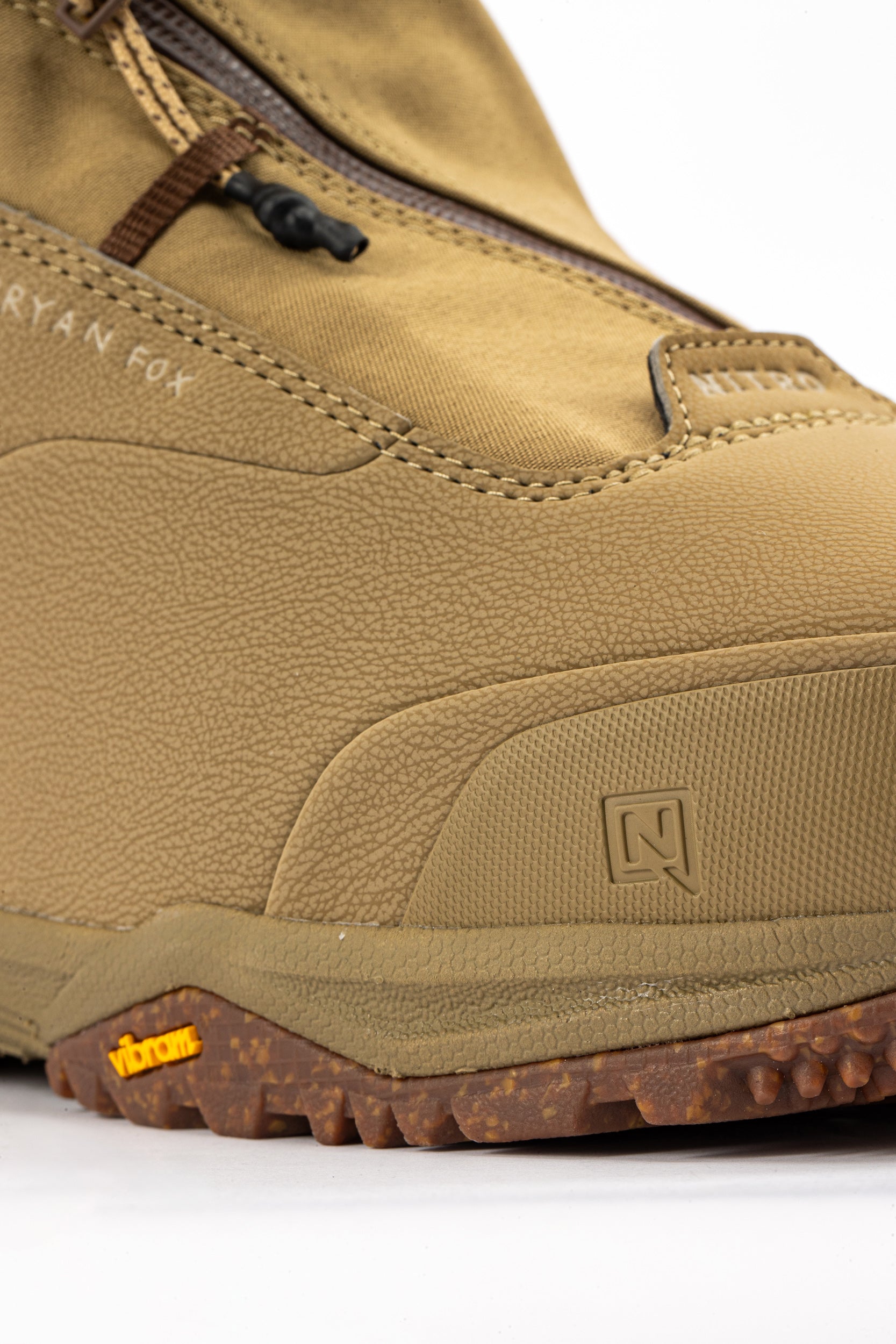 Brown Nitro Venture Pro Lace Snowboard Boots with padded tongue and sturdy sole, designed for snowboarding comfort and performance.
