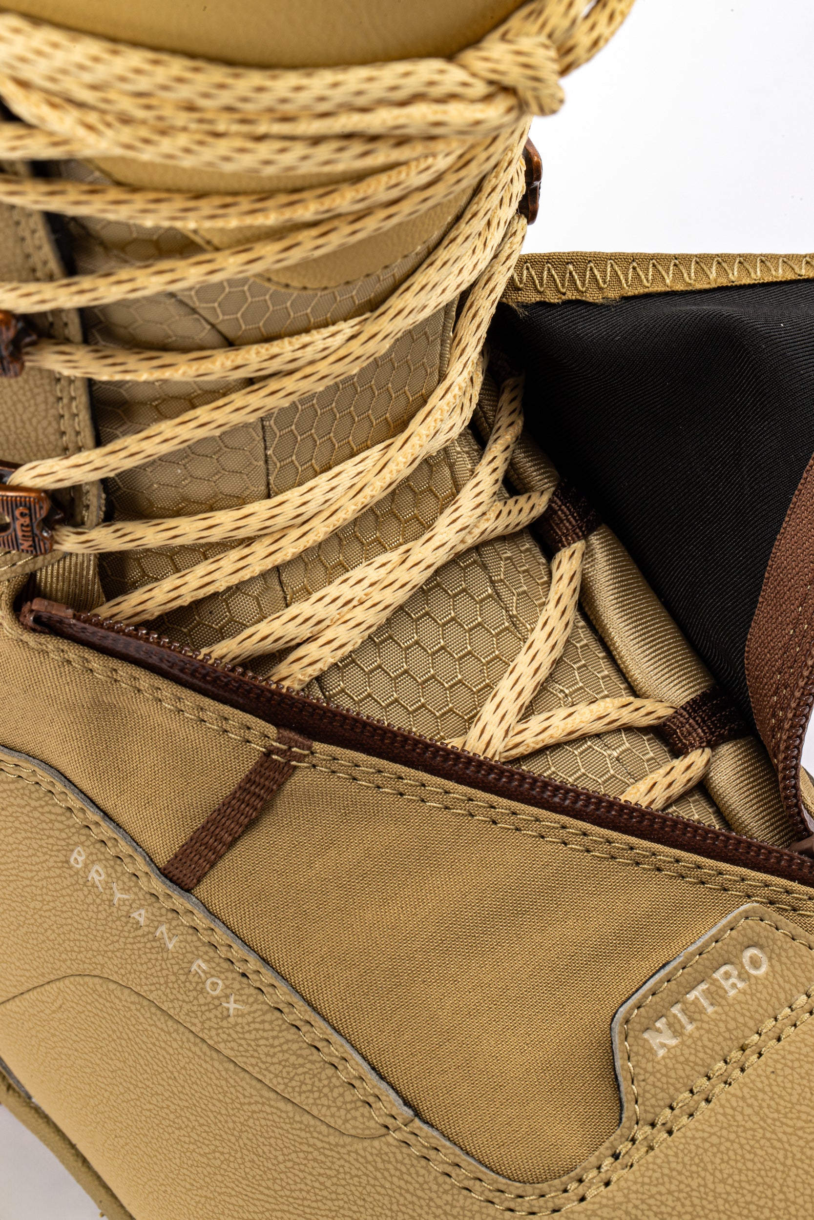 Brown Nitro Venture Pro Lace Snowboard Boots 2027, unzipped to show interior and lacing system, designed for snowboarding comfort.