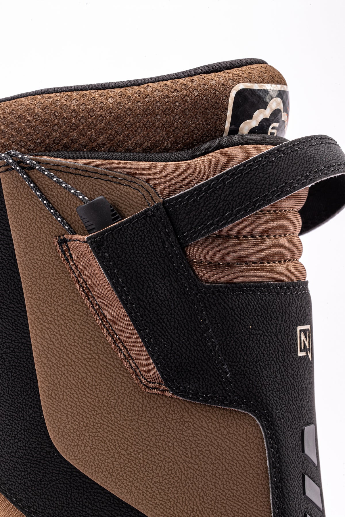 Black and brown Nitro Venture Pro TLS snowboard boots with heel loop and branding, designed for snowboarding in 2027.