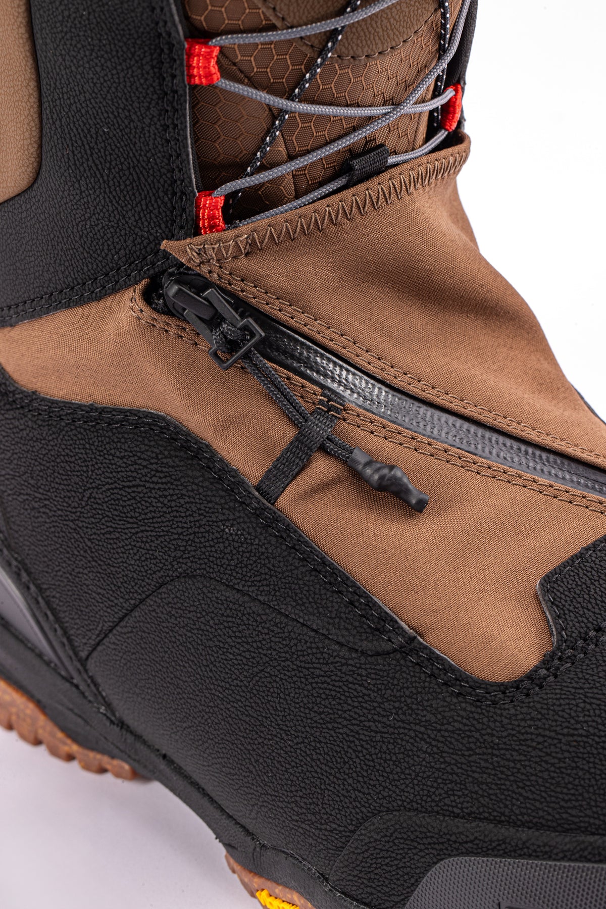 Brown and black Nitro Venture Pro TLS snowboard boots with zipper closure, designed for snowboarding in 2027.