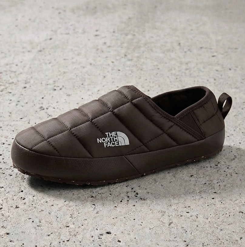 northface mule slipper i chestnut brown on a cement surface at milosport