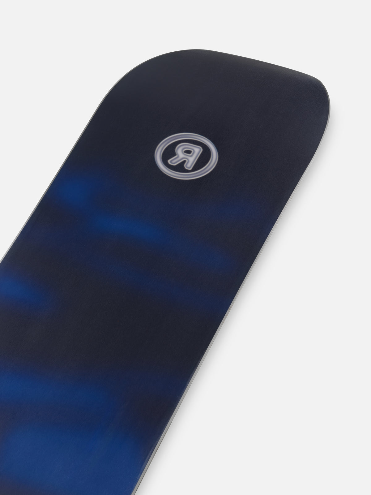 Ride Current Snowboard 2027 with snowy base and nose detail, designed for winter snowboarding adventures.
