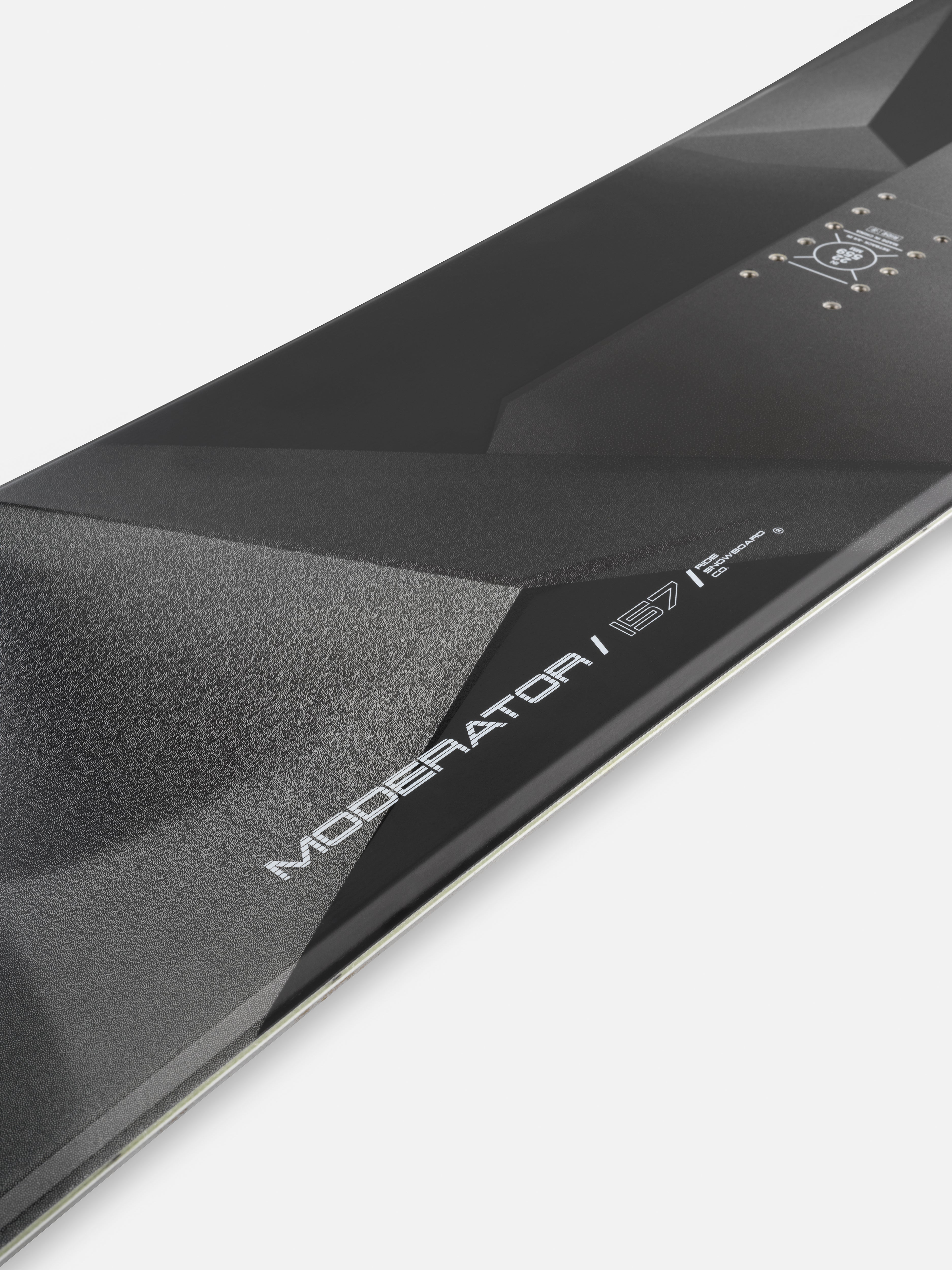 Ride Moderator Snowboard 2027 sidecut profile showing sleek design and Ride branding on the snowboard side in a snow setting.