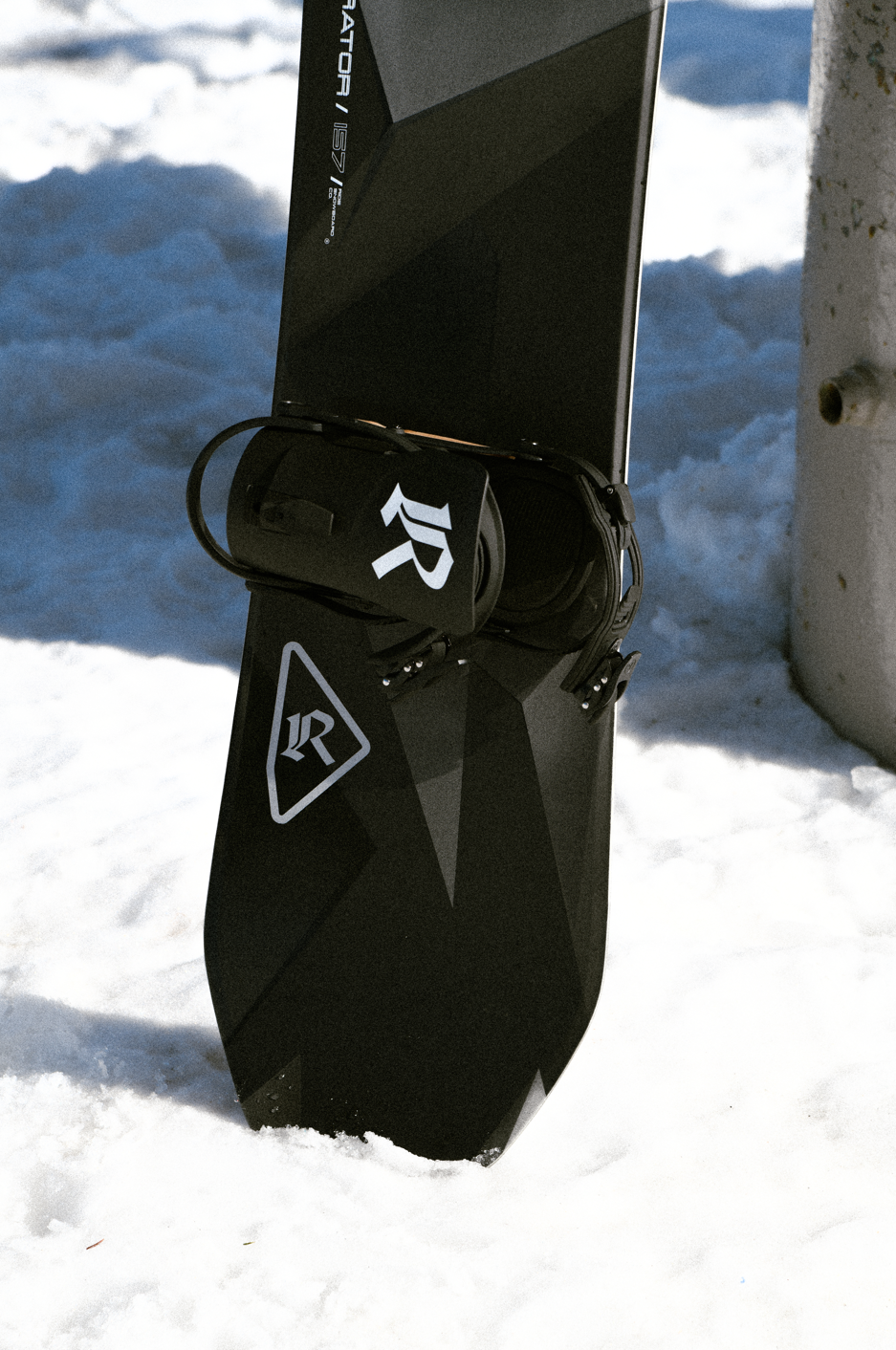 Ride Moderator Snowboard 2027 with tail lift design, showcasing the Ride brand snowboarding equipment for winter sports.