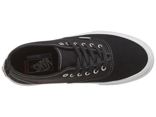 Vans Skate Authentic Mid shoes in black and white with classic low-top design, canvas upper, and rubber outsole.