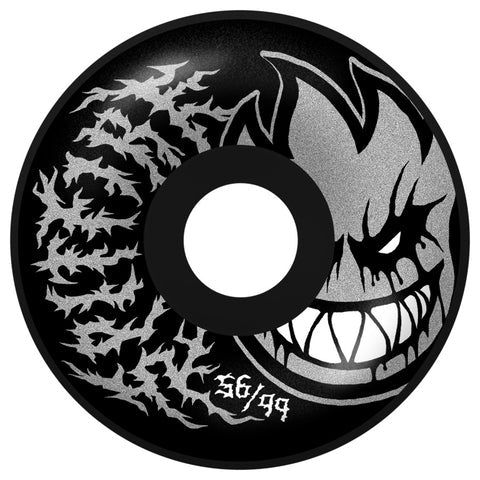 Skateboard wheel with a black and white design featuring a stylized face and text on a white background