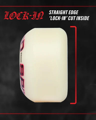 White skateboard truck with red and black text on a dark background