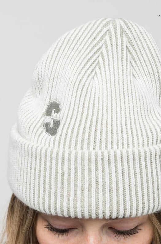 Souvenir Two Tone Rib Beanie worn by a person, showcasing two-tone knit design, suitable for men and women.