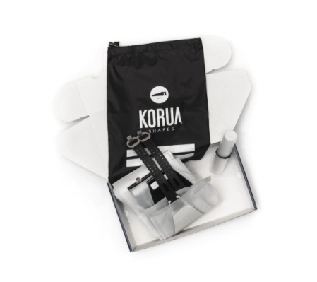 Korua climbing skins kit for splitboarding, designed for snow, with a textured surface and adjustable attachment points.